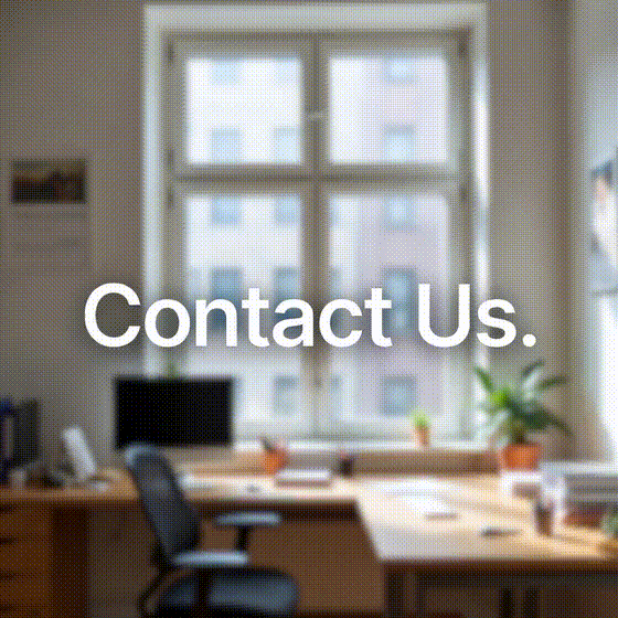 Animated GIF Contact Us hero – modern office workspace with city view window for Titan Peptides Research inquiries